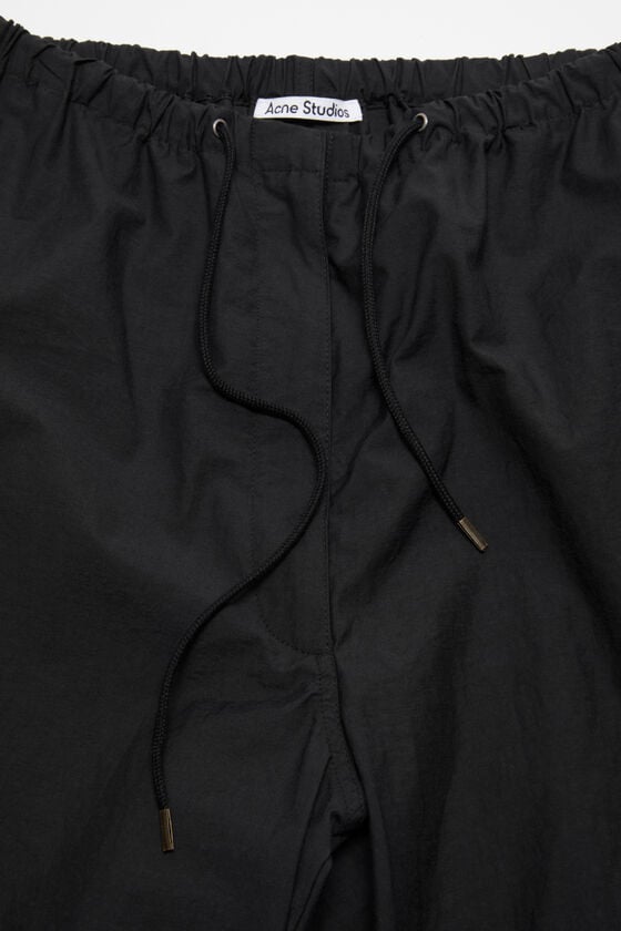 Acne Studios Hose in lockerer Passform Super Sparpreis